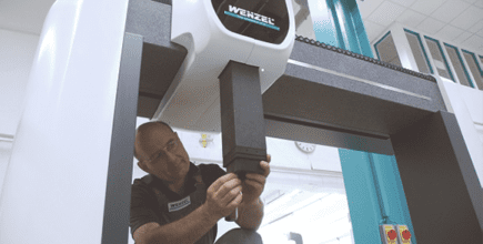 Man calibrating a Wenzel machine