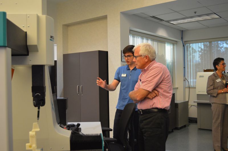 Two men discussing CMM Inspection