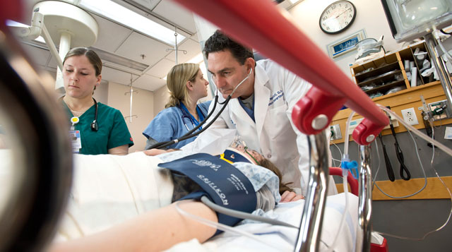 ER Doctor helping patient