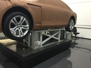 car model mounted on higher posts