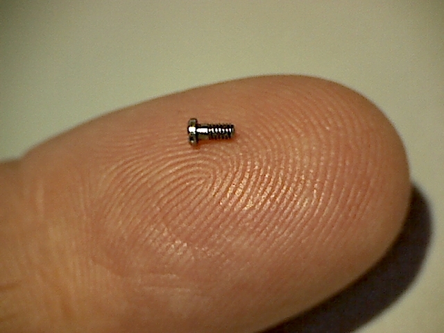 Screw on tip of finger for scale