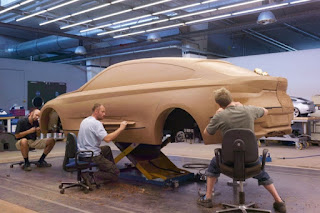 modelers working on the lower areas of car model